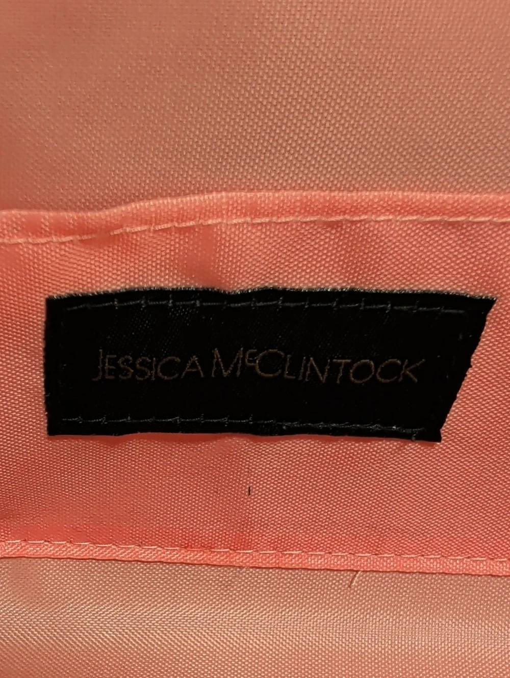 Jessica McClintock, Salmon Color Laser Cut Filigree Purse With Gold Background